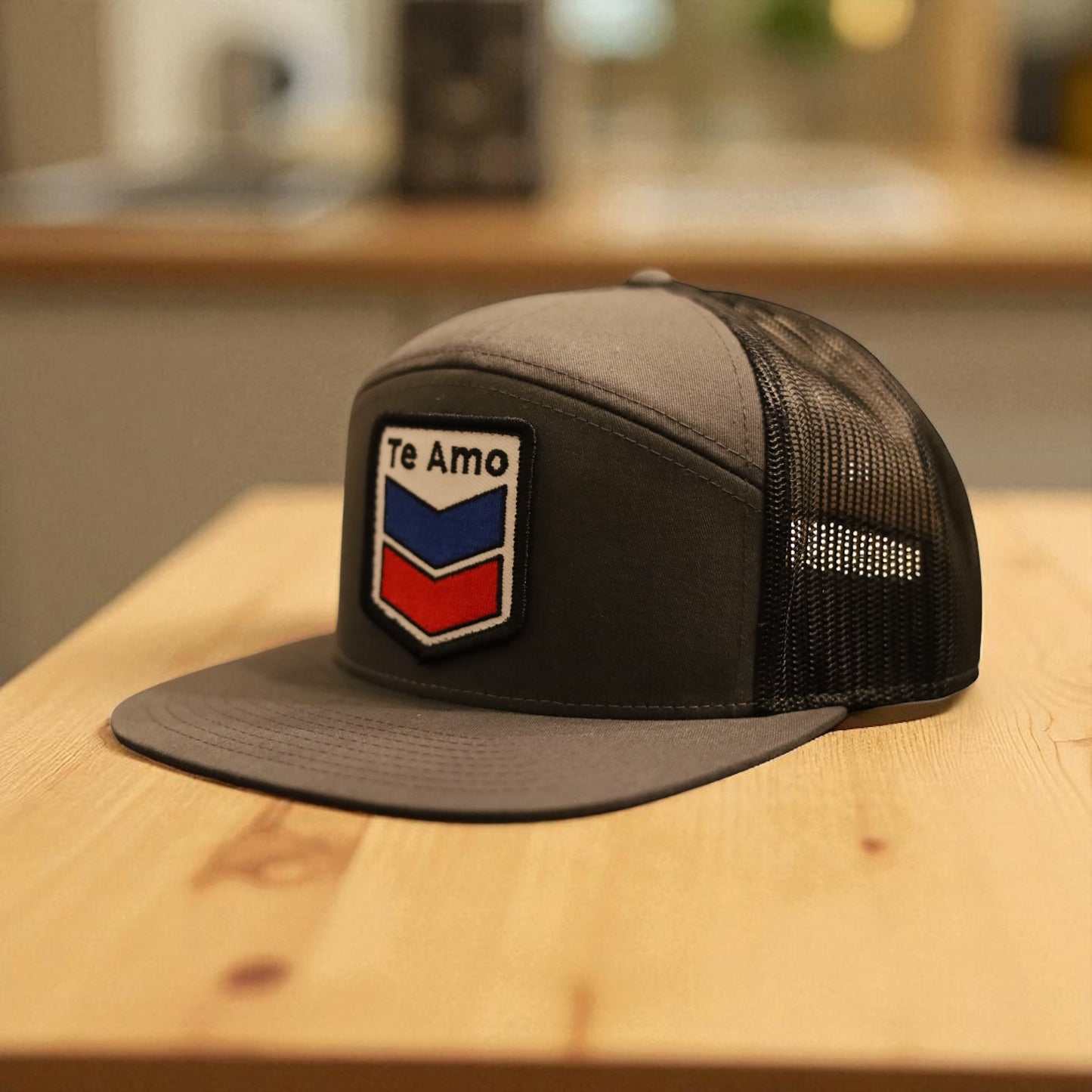 3 Bird Lifestyle Seven-Panel Trucker • Charcoal & Black • Te Amo (Blue & Red) Patch