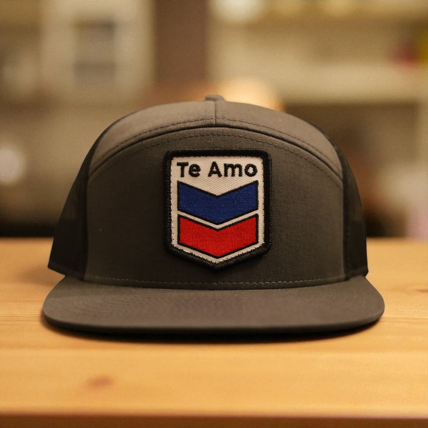 3 Bird Lifestyle Seven-Panel Trucker • Charcoal & Black • Te Amo (Blue & Red) Patch