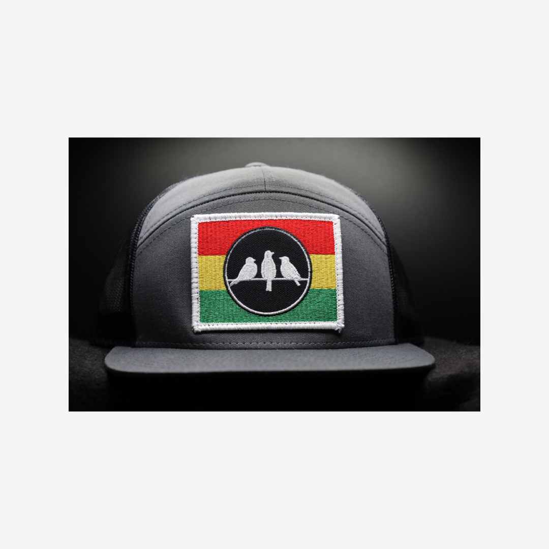 3 Bird Lifestyle Seven-Panel Trucker •Charcoal & Black • 3 Bird Rasta Flag Patch