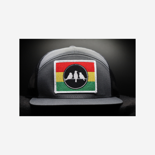 3 Bird Lifestyle Seven-Panel Trucker •Charcoal & Black • 3 Bird Rasta Flag Patch