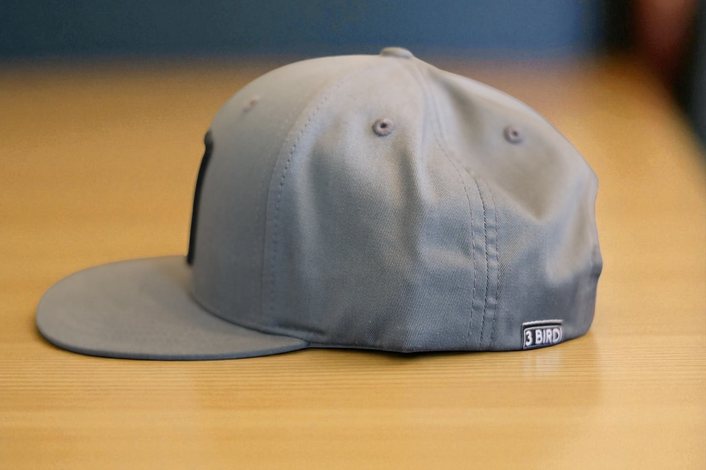 3 Bird Lifestyle Pinch Front Structured Trucker • Heather Grey • Te Amo (Blue & Red) Patch