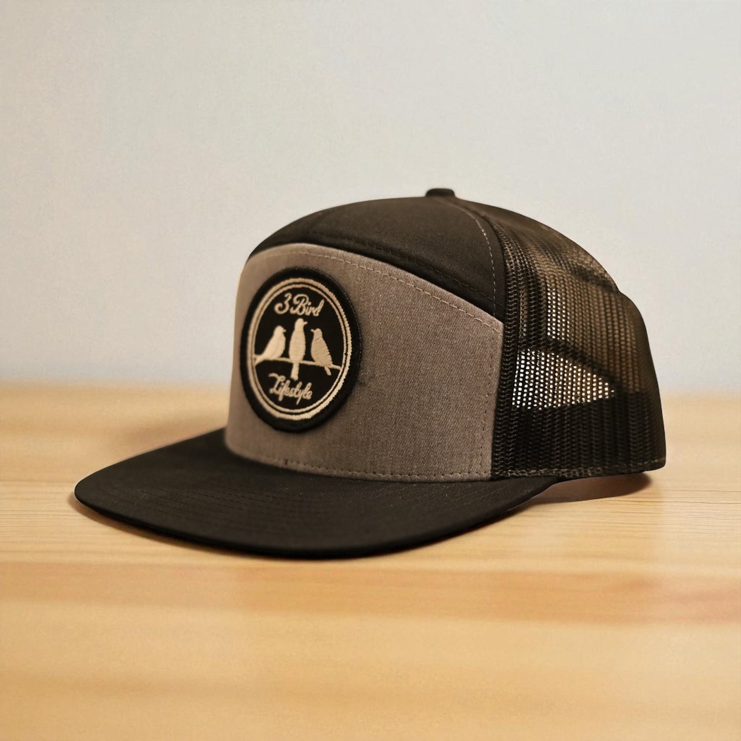3 Bird Lifestyle Seven-Panel Trucker 
 • Heather Grey & Black• 3 Bird Lifestyle Patch