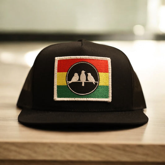 3 Bird Lifestyle Flat Bill Trucker
 • Black and Black • 3 Bird Rasta Flag Patch