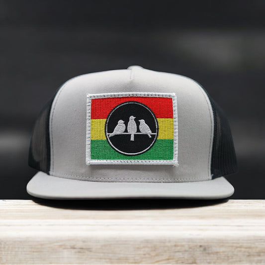 3 Bird Lifestyle Flat Bill Trucker
 •Silver & Black • 3 Bird Rasta Flag Patch