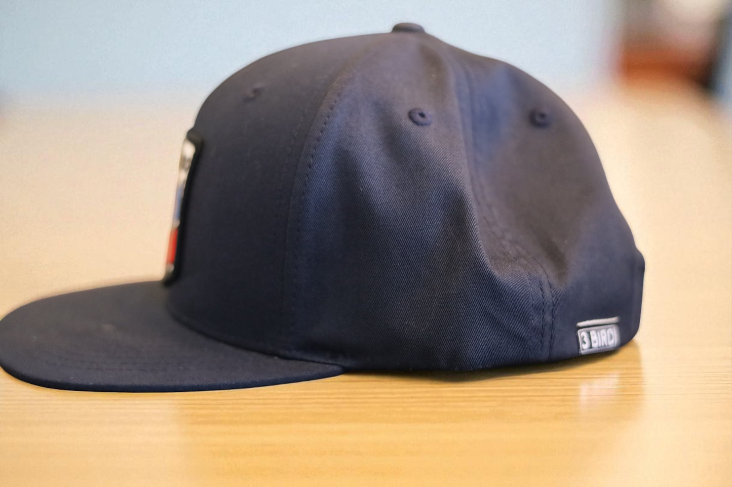 3 Bird Lifestyle Pinch Front Structured Trucker • Navy • Te Amo (Blue & Red) Patch