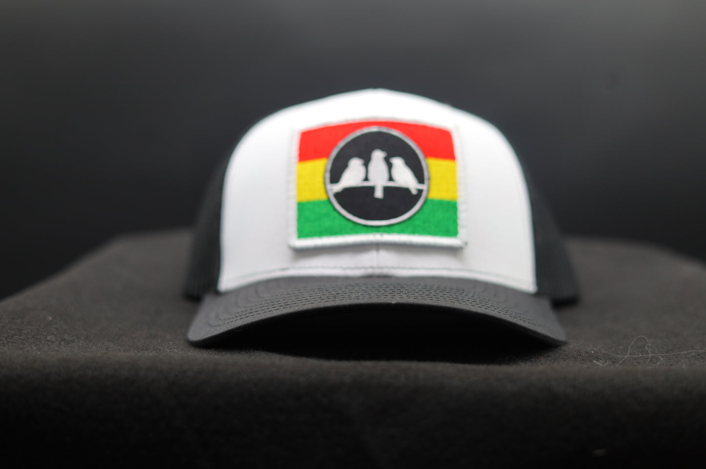 Richardson 112 Trucker Hat • White & Black • 3 Bird Rasta Flag Patch