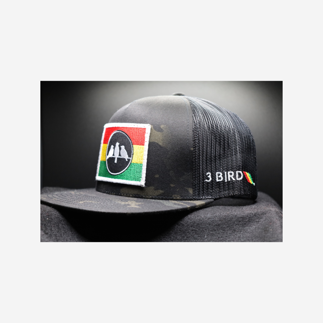 3 Bird Lifestyle Flat Bill Trucker
 •Multicam Black & Black • 3 Bird Rasta Flag Patch