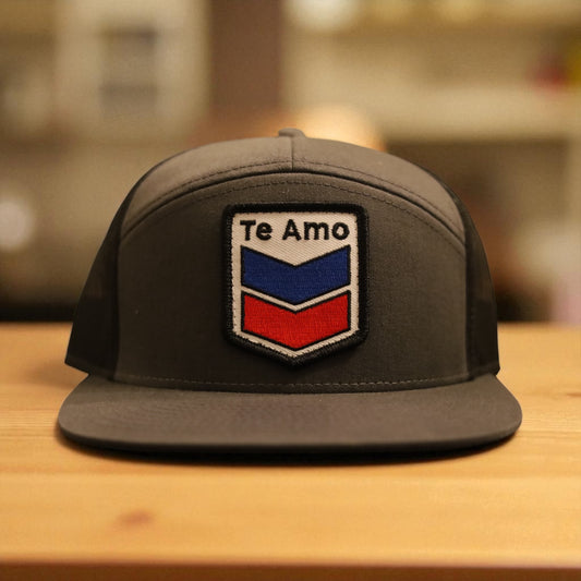 3 Bird Lifestyle Seven-Panel Trucker • Charcoal & Black • Te Amo (Blue & Red) Patch