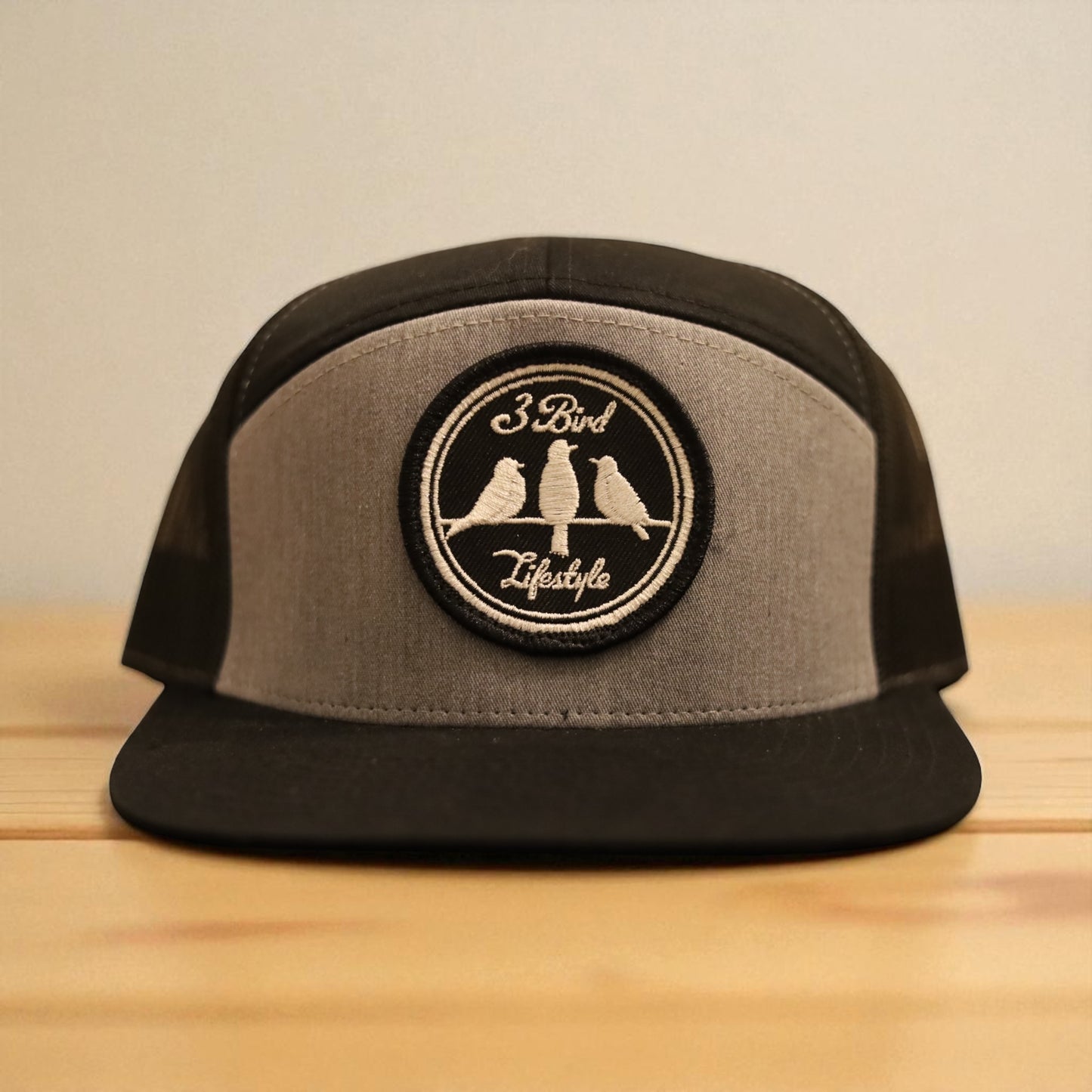 3 Bird Lifestyle Seven-Panel Trucker 
 • Heather Grey & Black• 3 Bird Lifestyle Patch