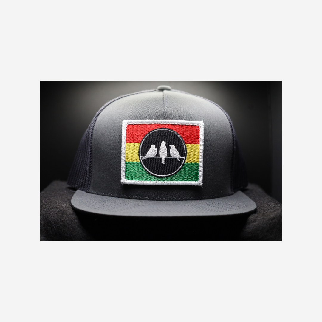 3 Bird Lifestyle Flat Bill Trucker • Charcoal Grey and Grey• 3 Bird Rasta Flag Patch