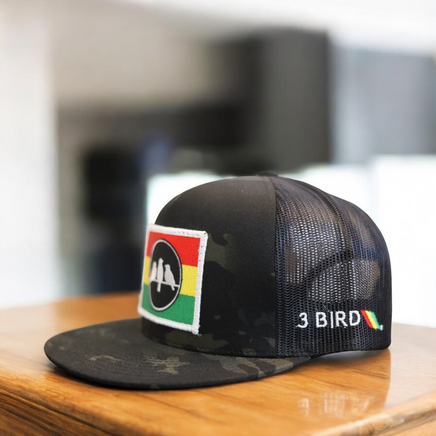 3 Bird Lifestyle Flat Bill Trucker
 •Multicam Black & Black • 3 Bird Rasta Flag Patch