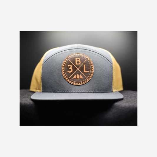 3 Bird Lifestyle Seven-Panel Trucker •Charcoal & Old Gold• 3BXL Leather Patch