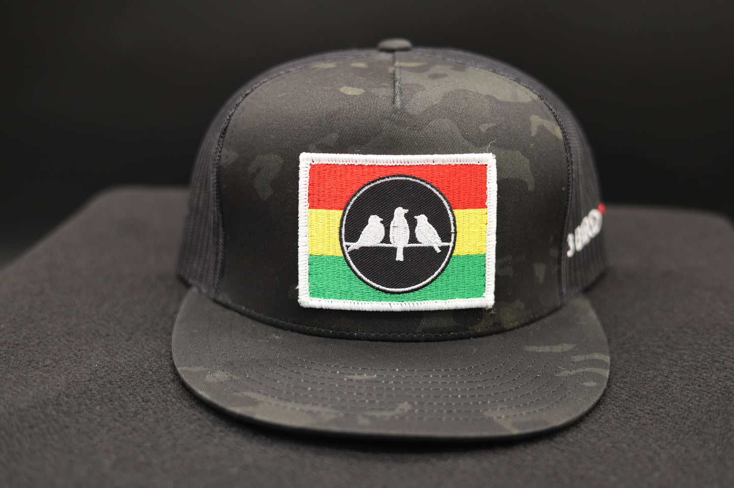 3 Bird Lifestyle Flat Bill Trucker
 •Multicam Black & Black • 3 Bird Rasta Flag Patch