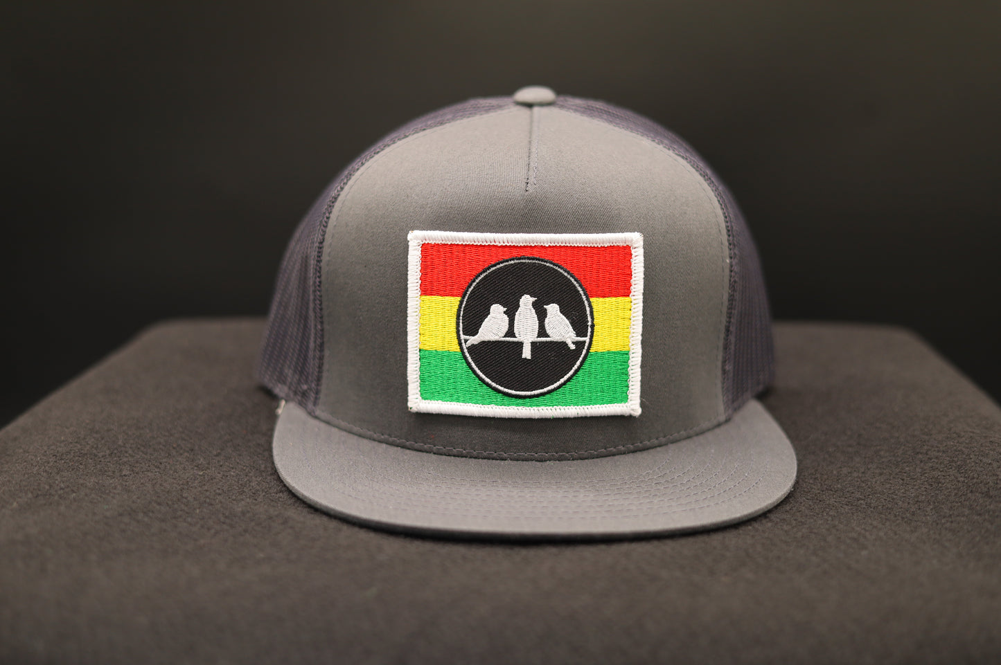 Old School Flat Bill Trucker • Charcoal Grey and Grey• 3 Bird Rasta Flag Patch